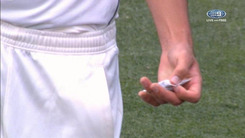 Mitchell Starc using a hand warmer