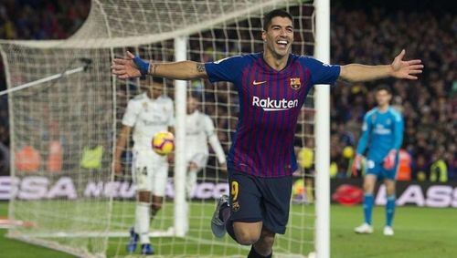 Luis Suarez scored twice as Barcelona beat Rayo Vallecano 3-2