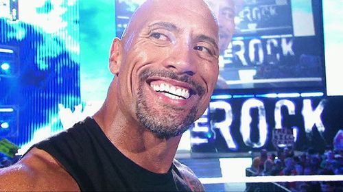 The Rock smiles for his legion of fans.