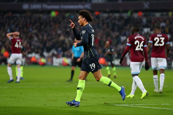 Sane wheels away to celebrate one of his two strikes during a memorable display