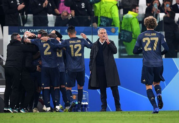Manchester United players celebrate after scoring in their group stage match against Juventus