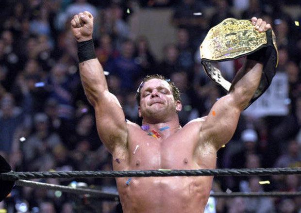 Chris Benoit holds the WWE World Championship aloft