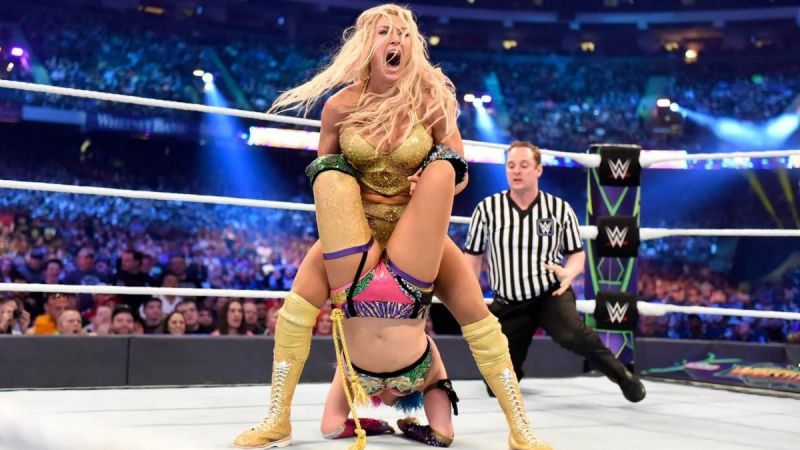 Charlotte Flair locks in a Boston Crab on Asuka