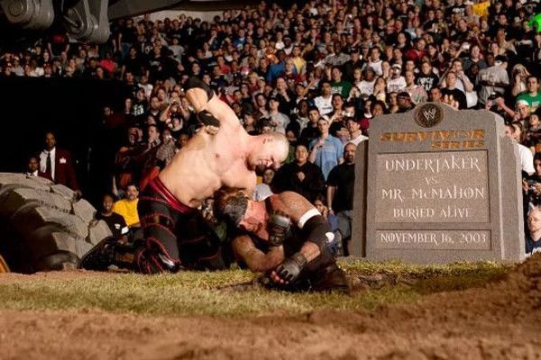 Kane attacking The Undertaker.