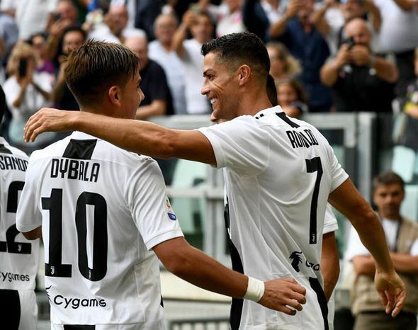 Cristiano Ronaldo is all smiles with Paulo Dybala