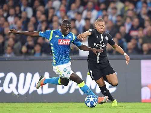 Napoli's Kalidou Koulibaly in a duel with Kylian Mbappe during the UEFA Champions League Group C match at the Stadio Sao Paolo