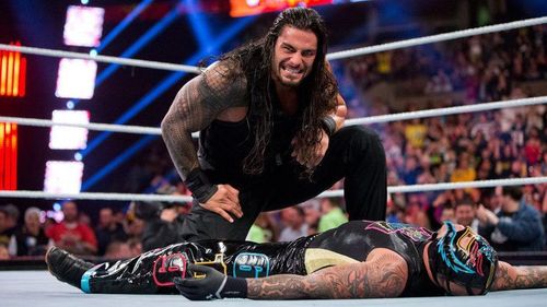 Roman Reigns eliminating Rey Mysterio