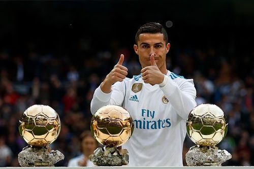 Ronaldo poses with his Ballon d'Or trophies