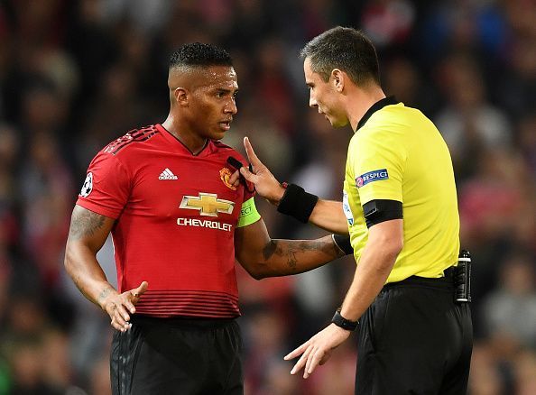 Antonio Valencia (L) in action during the UEFA Champions League