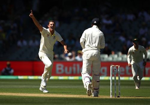 Josh Hazlewood celebrates after dismissing KL Rahul