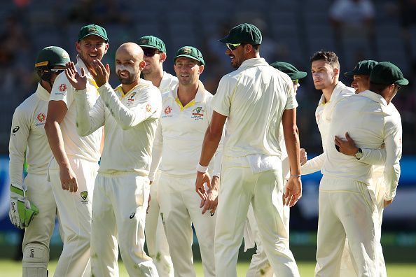 Australian team celebrate after the dismissal of Virat Kohli 