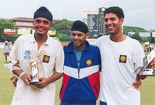 Yuvraj (far right) shows his player of the tournament trophy.