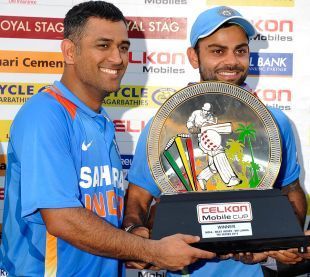 Image result for dhoni sends virat to collect celkon cup 2013 trophy