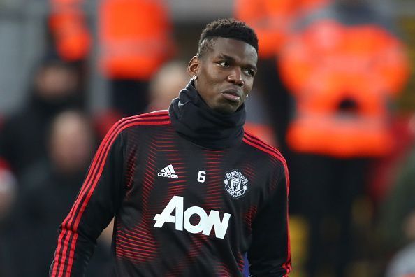 Pogba was left freezing on the bench in the Merseyside rain