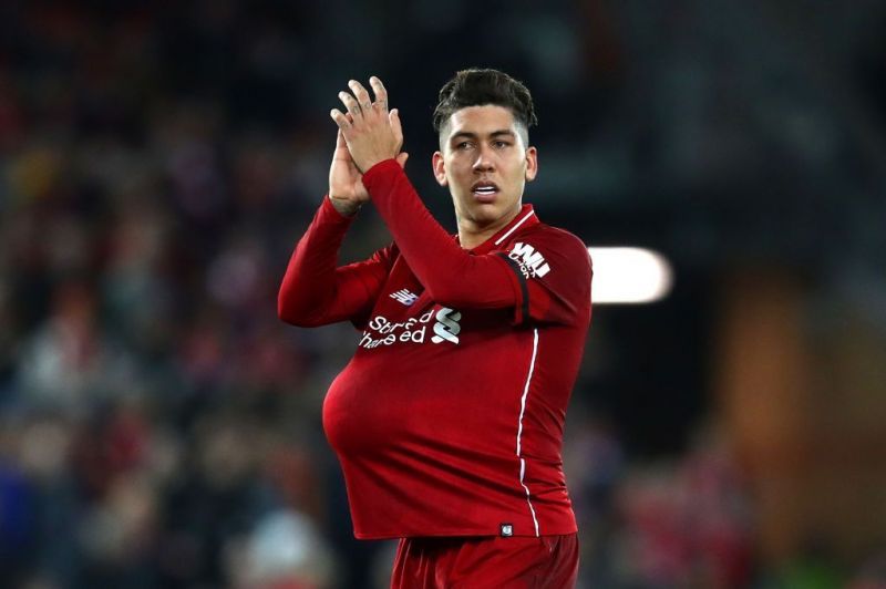 Roberto Firmino walks home with the match ball