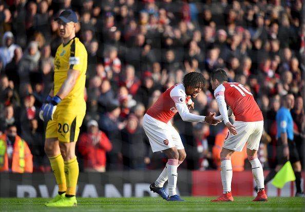 Ozil (R) created the third goal for Iwobi