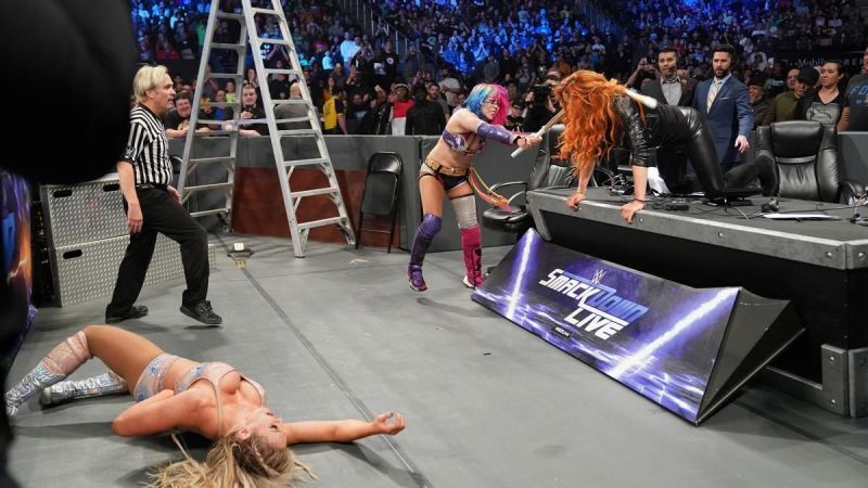 Asuka beating down Charlotte and Lynch!