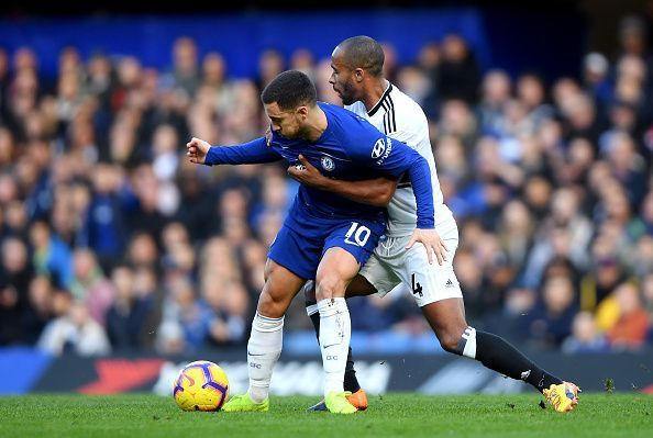 Eden Hazard harassed by Fulham defender Odoi