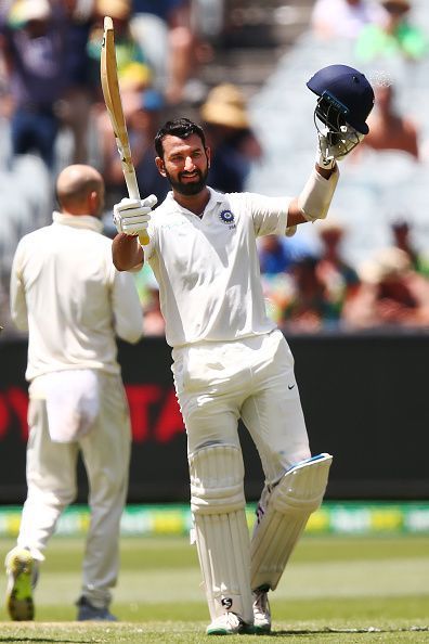 Cheteshwar Pujara celebrates after scoring his century