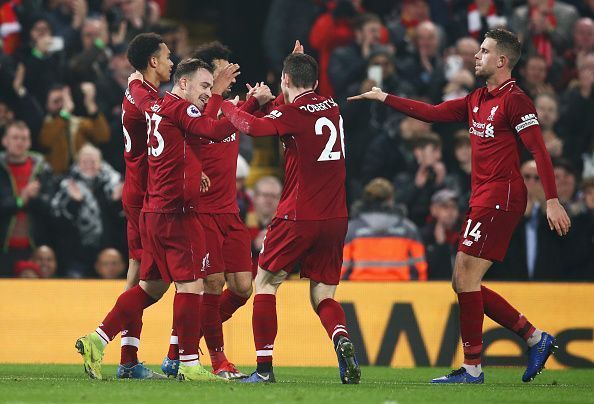 Liverpool players celebrate a goal against Newcastle