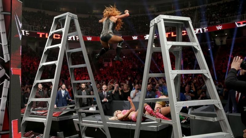 Becky performing the seated senton!