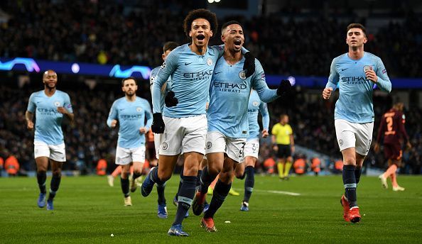 Sane wheels away to celebrate one of his two goals with his City teammates