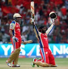 Gayle celebrates after completing his century