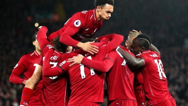 Liverpool players celebrate a goal