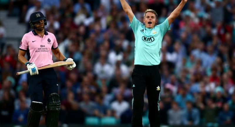 Sam Curran raises his arms after picking up a wicket for his county side Surrey
