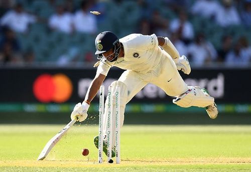 Pujara was run out on the last ball of the day thanks to a brilliant pick up and throw from Cummins