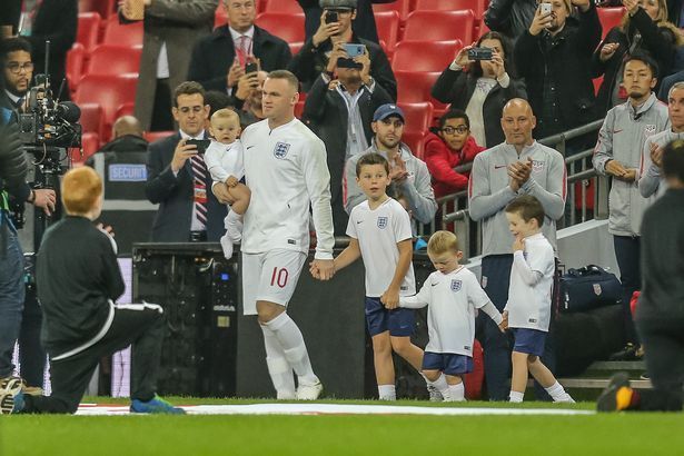 Wayne Rooney walking at Wembley with his sons