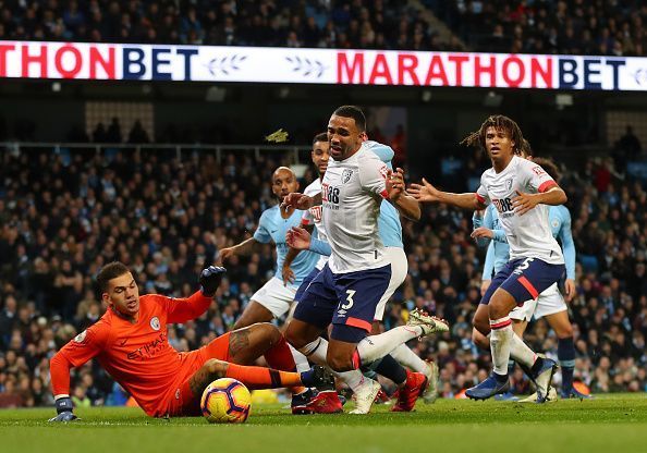 Ederson was fortunate not to give away a spot-kick after catching Wilson inside the box