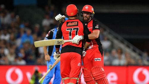 Mohammad Nabi and Dan Christian embrace