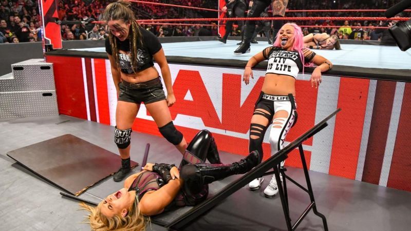 Why was Natalya put through a wooden table?