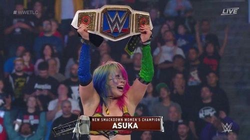 Asuka moments after winning the SmackDown Live Women's Championship at WWE TLC.