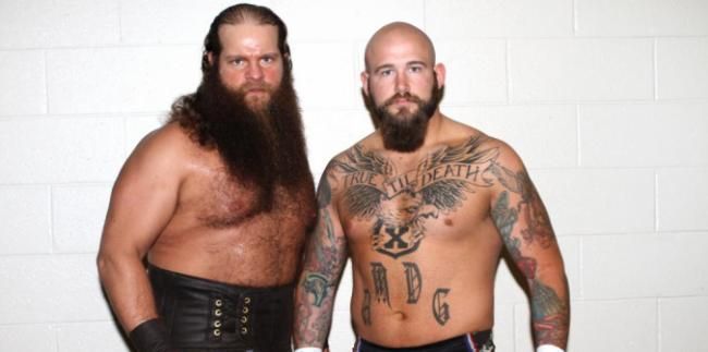 Hanson, left, with partner Raymond Rowe, has endured a rough transition to WWE.