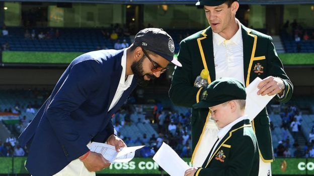 Archie Schiller, co-captain of Australia exchanging Team sheets with Virat Kohli during the toss at Boxing Day Test match