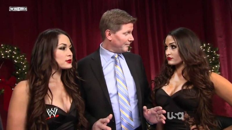 Bella Twins and John Laurinaitis