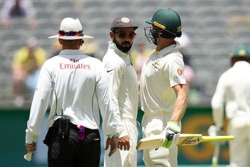 Virat Kohli and Tim Paine (r)