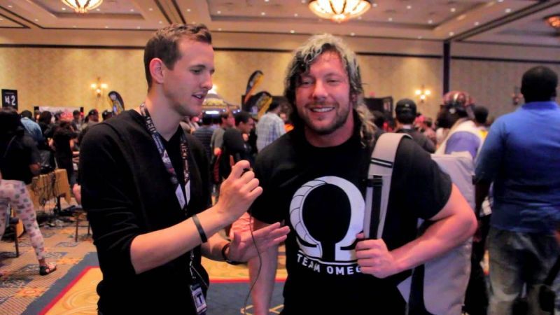 Kenny Omega connecting with fans at a meet and greet.