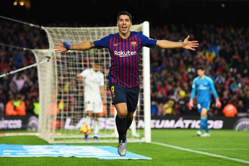 Suarez celebrating his hat-trick against Real Madrid