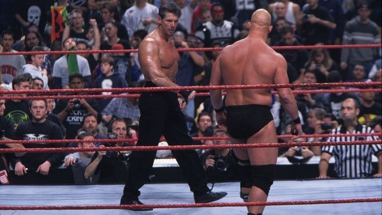 Mr. McMahon and Stone Cold circle as the 1999 Royal Rumble begins