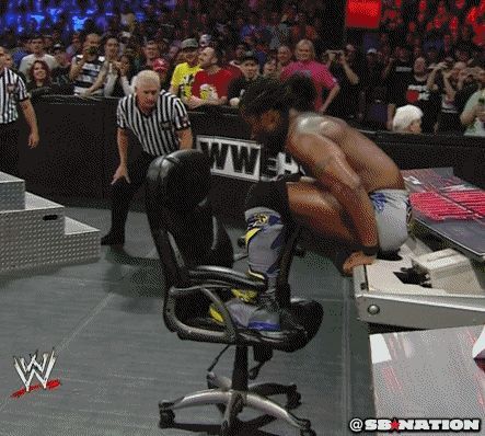 Kofi Kingston uses the chair to save himself