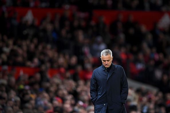 A dejected Mourinho trudges away, his back to a disgruntled fan base