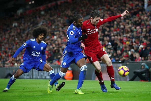 Ricardo and Robertson battling for the ball