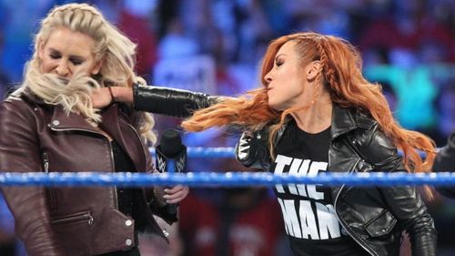 Suddenly, Becky strikes Charlotte in the face!