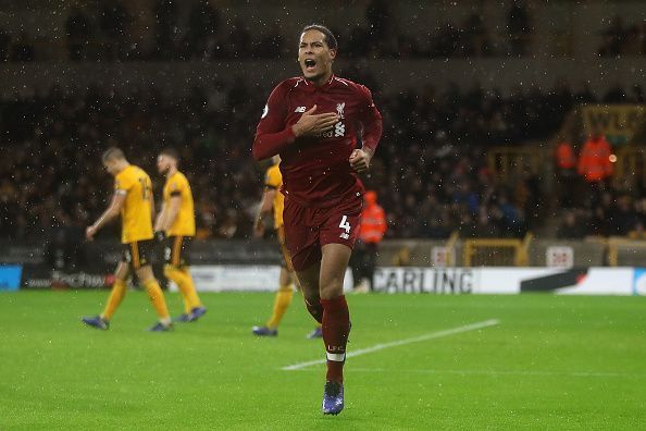 Van Dijk celebrates scoring his first league goal for Liverpool vs Wolves