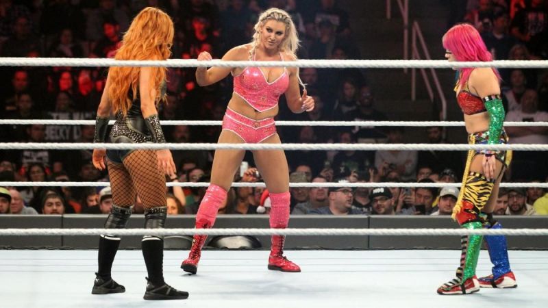 Asuka, Charlotte Flair and Becky Lynch during their match at TLC.