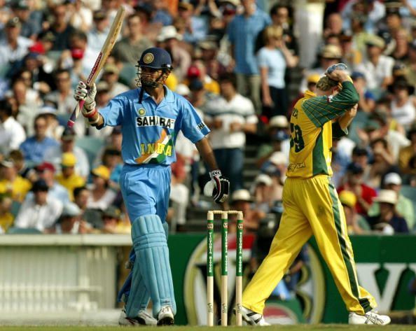 Badani raises his bat after scoring a half-century