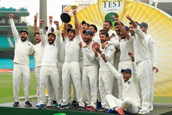 A jubilant Indian team lift the trophy after a 70 year wait to win a test series in Australia